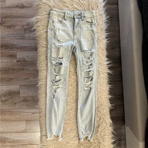 American eagle next level stretch distressed light colored ankle skinny jeans